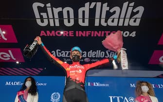 Swiss riders Gino Mader.of Bahrain Victorious team celebrates on the podium after winning the 6th stage of the 2021 Giro d'Italia cycling race over 187km from Piacenza to Sestola, Italy, 13 May 2021.
ANSA/LUCA ZENNARO