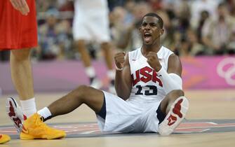 US guard Chris Paul celebrates during the London 2012 Olympic Games men's gold medal basketball game between USA and Spain at the North Greenwich Arena in London on August 12, 2012.            AFP PHOTO / TIMOTHY A.  CLARY        (Photo credit should read TIMOTHY A. CLARY/AFP/GettyImages)