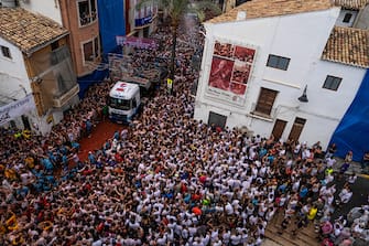 BUNOL, SPAIN - AUGUST 30: Revellers arrive at the town hall square in the back of a lorry containing tomatoes as they participate in the annual Tomatina festival on August 30, 2023 in Bunol, Spain. Spain's tomato throwing party in the streets of Bunol, Valencia brings together almost 20,000 people, with some 150,000 kilos of tomatoes thrown each year, this year with a backdrop of high food prices affected by Spain's historic drought. (Photo by Zowy Voeten/Getty Images)