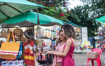 Mother and daughter looking at craft store, Olinda, Pernambuco