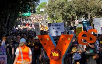 People take part in a "Walk for Yes" rally in Sydney on September 17, 2023. Thousands joined "Walk for Yes" events in major cities, ahead of the referendum that could grant Indigenous Australians a constitutionally enshrined right to be consulted on policies that affect them -- a "Voice to Parliament". (Photo by Andrew LEESON / AFP) (Photo by ANDREW LEESON/AFP via Getty Images)