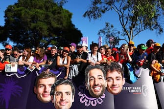 MELBOURNE, AUSTRALIA - MARCH 22: Fans hold cardboard cutout heads of Max Verstappen of the Netherlands and Oracle Red Bull Racing, Carlos Sainz of Spain and Ferrari, Daniel Ricciardo of Australia and Visa Cash App RB and Charles Leclerc of Monaco and Ferrari on the Melbourne Walk prior to practice ahead of the F1 Grand Prix of Australia at Albert Park Circuit on March 22, 2024 in Melbourne, Australia. (Photo by Mark Thompson/Getty Images)
