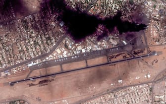 epa10576100 A handout satellite image made available by Maxar Technologies shows smoke over Khartoum International Airport, in Khartoum, Sudan, 16 April 2023. Heavy gunfire and explosions were reported in Sudan's capital Khartoum on 15 April between the army and a paramilitary group following days of tension centering around the country's proposed transition to civilian rule.  EPA/MAXAR TECHNOLOGIES HANDOUT -- MANDATORY CREDIT: SATELLITE IMAGE 2023 MAXAR TECHNOLOGIES -- THE WATERMARK MAY NOT BE REMOVED/CROPPED -- HANDOUT EDITORIAL USE ONLY/NO SALES