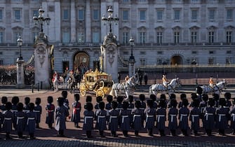 LONDON, ENGLAND - NOVEMBER 7: Members of the King's Guard line up outside Buckingham Palace as King Charles III and Queen Camilla depart in the Diamond Jubilee State Coach for the Houses of Parliament ahead of the State Opening of Parliament on November 7, 2023 in London, England. The speech delivered by the monarch but written by the government sets out the government's priorities for the coming year. This session of parliament will lead up to the next general election. (Photo by Carl Court/Getty Images)