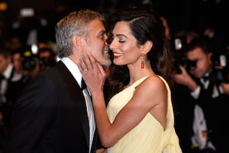 CANNES, FRANCE - MAY 12:  Actor George Clooney and his wife Amal Clooney attend the "Money Monster" premiere during the 69th annual Cannes Film Festival at the Palais des Festivals on May 12, 2016 in Cannes, France.  (Photo by Clemens Bilan/Getty Images)