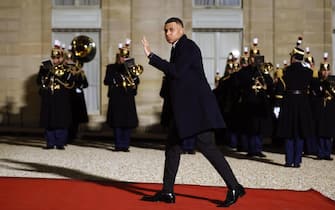 epa11185015 Paris Saint Germain's soccer player Kylian Mbappe arrives at the Elysee Palace for an official dinner on the sidelines of the state visit of Qatari Emir Sheikh Tamim bin Hamad Al-Thani in Paris, France, 27 February 2024.  EPA/YOAN VALAT