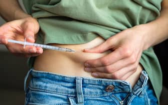 A woman with diabetes pulls back the skin on her stomach and gives an injection of insulin with a disposable syringe with a small needle, or a girl planning a pregnancy stimulates ovulation before artificial insemination or conception.