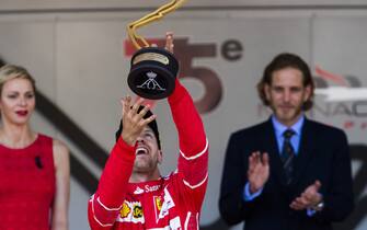 Monte Carlo, Monaco.
Sunday 28 May 2017.
Sebastian Vettel, Ferrari, 1st Position, celebrates on the podium with his trophy.
World Copyright: Sam Bloxham/LAT Images
ref: Digital Image _W6I5462