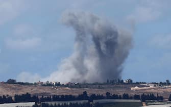epa11637426 Smoke rises during an Israeli airstrike near Yaroun village in southern Lebanon, as seen from an undisclosed location on the Israeli side of the border, northern Israel, 02 October 2024. The Israeli military reported that additional forces were joining the raids on Hezbollah targets and infrastructure in southern Lebanon that began on 30 September.  EPA/ATEF SAFADI