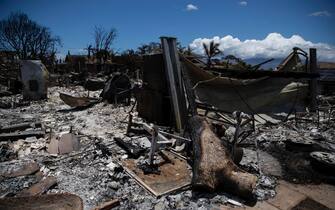epa10802253 A house is in ruins after being destroyed by the Lahaina Fire in Lahaina, Hawaii, USA, 15 August 2023. At least 99 people were killed in the Lahaina wildfire that burnt in Maui, which is considered the largest natural disaster in Hawaii's state history.  EPA/ETIENNE LAURENT