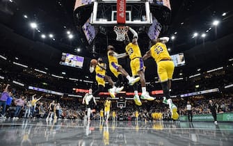 MEMPHIS, TENNESSEE - APRIL 12: (EDITORS NOTE: Image is a digital composite.) LeBron James #23 of the Los Angeles Lakers goes to the basket during the second half of the game against the Memphis Grizzlies at FedExForum on April 12, 2024 in Memphis, Tennessee. NOTE TO USER: User expressly acknowledges and agrees that, by downloading and or using this photograph, User is consenting to the terms and conditions of the Getty Images License Agreement. (Photo by Justin Ford/Getty Images)