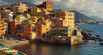 Typical village of Italian Riviera. Its name is Boccadasse and it is old fishermen village. Buildings are right on Mediterranean Sea.