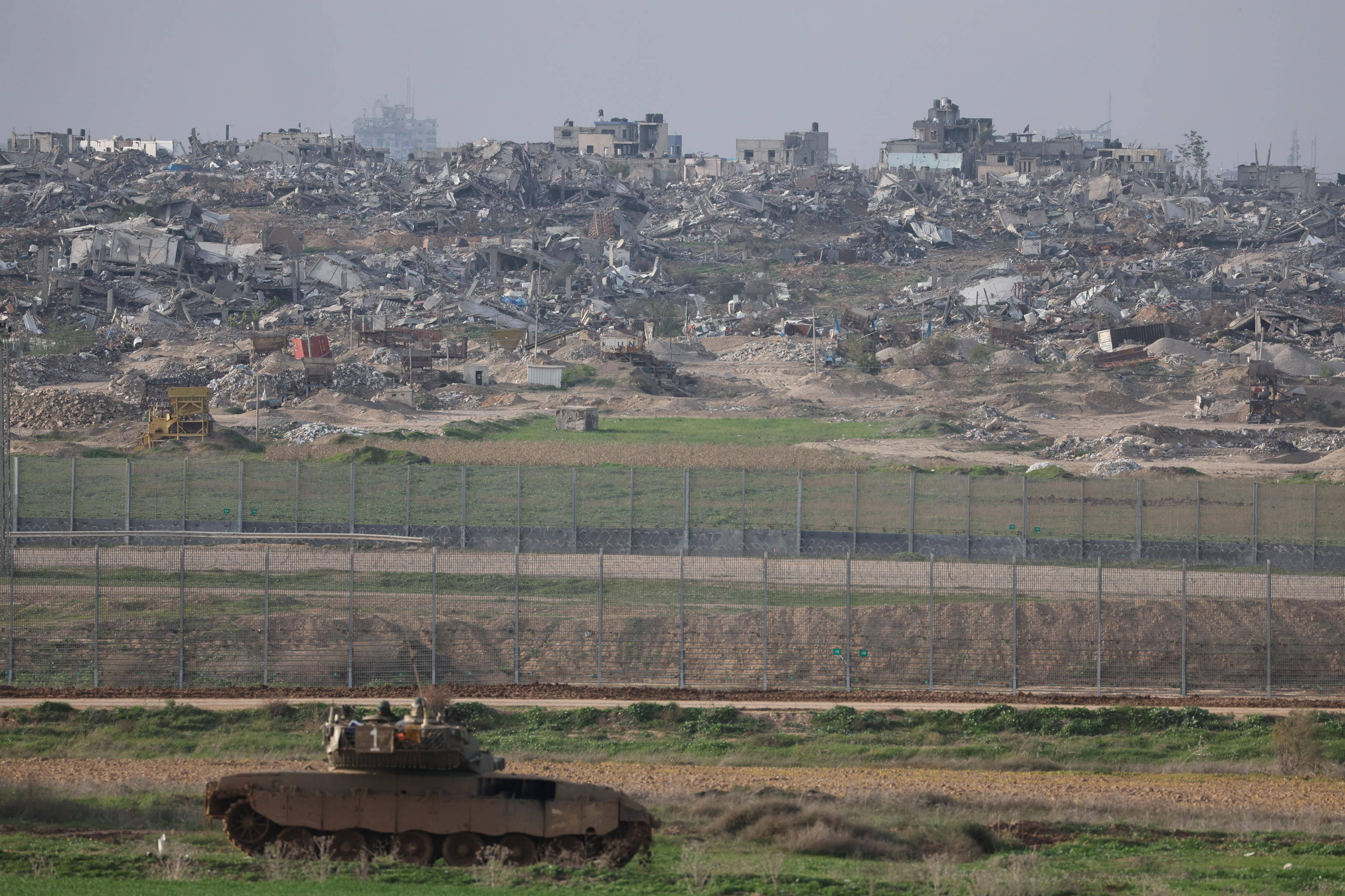 epa11085192 An Israeli tank is on a position near the Israeli border with the Gaza Strip, in southern Israel, 17 January 2024. More than 24,400 Palestinians and at least 1,300 Israelis have been killed, according to the Palestinian Health Ministry and the Israel Defense Forces (IDF), since Hamas militants launched an attack against Israel from the Gaza Strip on 07 October, and the Israeli operations in Gaza and the West Bank which followed it.  EPA/ABIR SULTAN