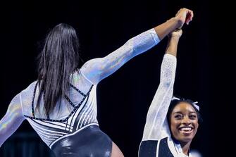 epa10786989 US artistic gymnast Simone Biles (R) reacts with fellow gymnast Zoe Miller (L) during the awards ceremony after the Core Hydration Classic at the NOW Arena in Hoffman Estates, Illinois, USA, 05 August 2023. Biles is returning to competition after a two-year break after the Tokyo Olympics.  EPA/ALEX WROBLEWSKI