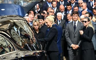 TOPSHOT - Italian former Prime Minister, Silvio Berlusconi daughter Marina Berlusconi (L), partner of Silvio Berlusconi Marta Fascina, son Luigi Berlusconi and daughter Barbara Berlusconi (R) pay their respect at the end of Italy's former Prime Minister and media mogul Silvio Berlusconi funeral outside the Duomo cathedral in Milan on June 14, 2023. (Photo by Piero CRUCIATTI / AFP) (Photo by PIERO CRUCIATTI/AFP via Getty Images)