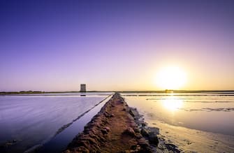 SCENIC VIEW OF BEACH AGAINST SKY DURING SUNSET
