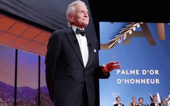 CANNES, FRANCE - MAY 16: Michael Douglas speaks on stage during the opening ceremony at the 76th annual Cannes film festival at Palais des Festivals on May 16, 2023 in Cannes, France. (Photo by Pascal Le Segretain/Getty Images)