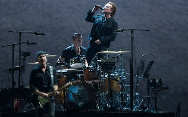 MUMBAI, INDIA - DECEMBER 15: Irish rock band U2 performs as part of The Joshua Tree tour at DY Patil Stadium, Nerul   on December 15, 2019 in Mumbai, India.  The band, that was formed in 1976 in Dublin, consists of Bono (lead vocals and rhythm guitar), the Edge (lead guitar, keyboards, and backing vocals), Adam Clayton (bass guitar), and Larry Mullen Jr. (drums and percussion). (Photo by Pratik Chorge/Hindustan Times via Getty Images)