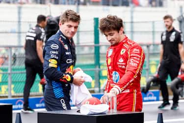 Red Bull Racing's Dutch driver Max Verstappen (L) and Ferrari's Monegasque driver Charles Leclerc react after the qualifying session ahead of the Formula One Belgian Grand Prix at the Spa-Francorchamps Circuit in Spa on July 27, 2024. (Photo by SIMON WOHLFAHRT / AFP) (Photo by SIMON WOHLFAHRT/AFP via Getty Images)