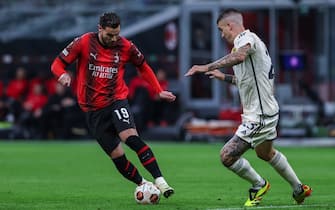 Theo Hernandez of AC Milan seen in action with Gianluca Mancini of AS Roma during UEFA Europa League 2023/24 Quarter Finals - 1st  leg football match between AC Milan and AS Roma at San Siro Stadium, Milan, Italy on April 11, 2024