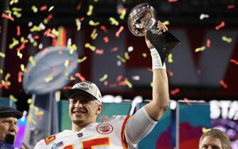 epa10464373 Kansas City Chiefs quarterback Patrick Mahomes hoists the Vince Lombardi Trophy after defeating the Philadelphia Eagles in Super Bowl LVII between the AFC champion Kansas City Chiefs and the NFC champion Philadelphia Eagles at State Farm Stadium in Glendale, Arizona, 12 February 2023. The annual Super Bowl is the Championship game of the NFL between the AFC Champion and the NFC Champion and has been held every year since January of 1967.  EPA/CAROLINE BREHMAN