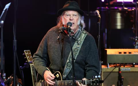 LOS ANGELES, CALIFORNIA - APRIL 26: Neil Young performs onstage at Light Up the Blues 7 Concert Celebrating Autism Speaks' 20th Anniversary at The Greek Theatre on April 26, 2025 in Los Angeles, California. (Photo by Kevin Winter/Getty Images)