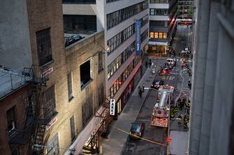 NEW YORK, UNITED STATES - APRIL 18: Firefighters inspect the partially collapsed parking garage in Manhattan, New York, United States on April 18, 2023. A parking garage partially collapsed in New York City on Tuesday, leaving at least one person dead and several others injured. (Photo by Mostafa Bassim/Anadolu Agency via Getty Images)