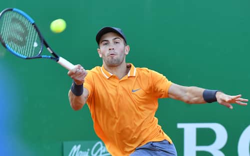 Croatia's Borna Coric hits a return to Italy's Fabio Fognini during their quarter final tennis match at the Monte-Carlo ATP Masters Series tournament on April 19, 2019 in Monaco. (Photo by YANN COATSALIOU / AFP)        (Photo credit should read YANN COATSALIOU/AFP via Getty Images)