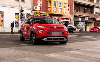 New red Citroen C3 Aircross. 2018. model. Exterior of the car. Brand new Citroen on the city streets.