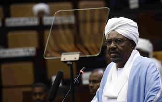 Sudanese President Omar al-Bashir addresses parliament in the capital Khartoum on April 1, 2019 in his first such speech since he imposed a state of emergency across the country on February 22. - Bashir acknowledged that the demands of protesters demonstrating against his government were "legitimate' but were expressed unlawfully causing several deaths. (Photo by ASHRAF SHAZLY / AFP)        (Photo credit should read ASHRAF SHAZLY/AFP via Getty Images)