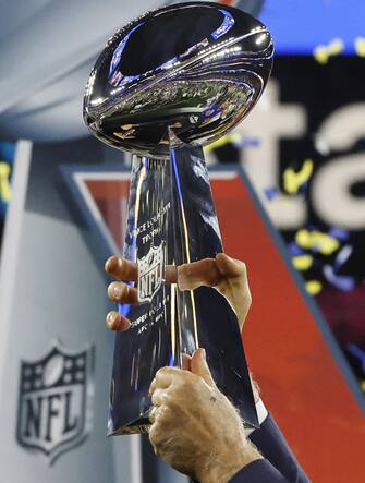 epa09754592 Los Angeles Rams owner Stan Kroenke holds up the Vince Lombardi Trophy after the Los Angeles Rams defeated the Cincinnati Bengals to win Super Bowl LVI at SoFi Stadium in Inglewood, California, USA, 13 February 2022. The annual Super Bowl is the Championship game of the NFL between the AFC Champion and the NFC Champion and has been held every year since January of 1967.  EPA/JOHN G. MABANGLO