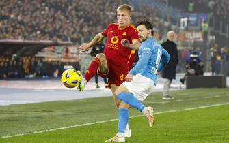 AS Roma's Rasmus Kristensen (L), Napoli's Mario Rui during the Italian Serie A soccer match between AS Roma and SSC Napoli at the Olimpico stadium in Rome, Italy, 23 December 2023. ANSA/FABIO FRUSTACI