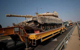 epa10907766 Israeli army transports tanks toward border with Gaza, 08 October 2023. Israel announced initiating a large-scale operation 'Swords of Iron' after surprise attacks on Israel on 07 October claimed by the Islamist movement Hamas killed more than 670 Israelis and left over 2,100 injured in the attacks, the Israeli army said 08 October.  EPA/ATEF SAFADI