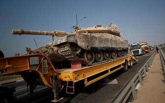 epa10907766 Israeli army transports tanks toward border with Gaza, 08 October 2023. Israel announced initiating a large-scale operation 'Swords of Iron' after surprise attacks on Israel on 07 October claimed by the Islamist movement Hamas killed more than 670 Israelis and left over 2,100 injured in the attacks, the Israeli army said 08 October.  EPA/ATEF SAFADI