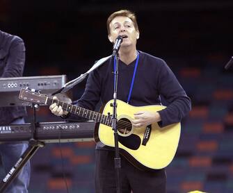 Sir Paul McCartney rehearses for his part in the Super Bowl XXXVI Pre-Game Show, February 3, 2002, at the Superdome in New Orleans, Louisiana. (Photo by KMazur/WireImage)