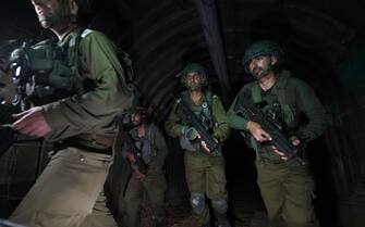 epa11034256 A photo taken while embedded with the Israeli Army shows soldiers inside a tunnel 400 meters away from the Erez crossing between Gaza and Israel, in the Palestinian town of Beit Hanun, northern Gaza Strip, 15 December 2023 (issued 17 December 2023). At least 18,000 Palestinians and at least 1,200 Israelis have been killed, according to the Palestinian Health Ministry and the Israel Defense Forces (IDF), since Hamas militants launched an attack against Israel from the Gaza Strip on 07 October, and the Israeli operations in Gaza and the West Bank which followed it.  EPA/ATEF SAFADI