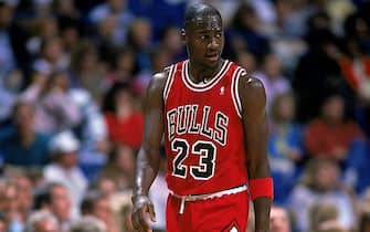 1989:  Michael Jordan #23 of the Chicago Bulls walks and looks on from the court during the game.   Mandatory Credit: Joe Patronite  /Allsport