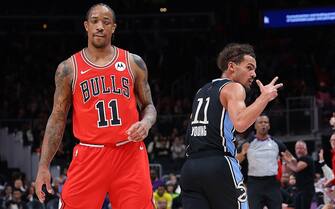 ATLANTA, GEORGIA - FEBRUARY 12:  Trae Young #11 of the Atlanta Hawks reacts after hitting a three point basket against the Chicago Bulls during the first quarter at State Farm Arena on February 12, 2024 in Atlanta, Georgia.  NOTE TO USER: User expressly acknowledges and agrees that, by downloading and/or using this photograph, user is consenting to the terms and conditions of the Getty Images License Agreement.  (Photo by Kevin C. Cox/Getty Images)