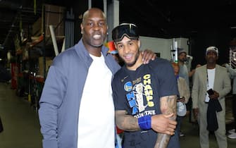 BOSTON, MA - JUNE 16: NBA Legend Gary Payton and his son Gary Payton II #0 of the Golden State Warriors poses for a photo after the game against the Boston Celtics in Game Six of the 2022 NBA Finals on June 16, 2022 at TD Garden in Boston, Massachusetts. NOTE TO USER: User expressly acknowledges and agrees that, by downloading and or using this photograph, user is consenting to the terms and conditions of Getty Images License Agreement. Mandatory Copyright Notice: Copyright 2022 NBAE (Photo by Michael J. LeBrecht II/NBAE via Getty Images)