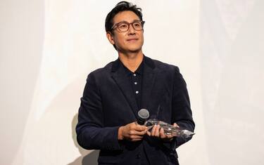 CHICAGO, ILLINOIS - OCTOBER 07: Actor Lee Sun Kyun receives the award for "Excellent Achievement in Film" during the introduction of the "Killing Romance" Midwest premiere at AMC New City 14 on October 07, 2023 in Chicago, Illinois. (Photo by Barry Brecheisen/Getty Images)