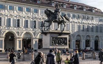 TURIN, ITALY - DECEMBER 07: People stroll around the equestrian monument of Emmanuel Philibert of Savoy (aka Caval ed bronz, Horse of bronze) in the central Piazza San Carlo, on December 07, 2023 in Turin, Italy. (Photo by Emanuele Cremaschi/Getty Images)