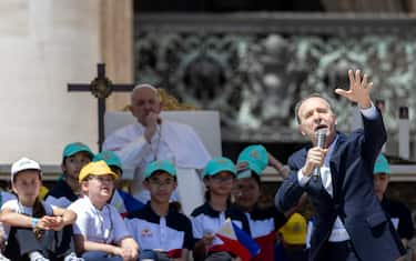 Pope Francis listens to a speech by Italian film director Roberto Benigni during a mass on World Children's Day at Saint Peter's Basilica in the Vatican City, 26 May 2024. 
ANSA/MASSIMO PERCOSSI