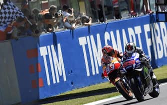 Spanish MotoGP rider Jorge Lorenzo (R) of the Movistar Yamaha  is on his way to win the Motorcycling Grand Prix of Italy at the Mugello circuit in Scarperia, central Italy, 22 May 2016.  Follow Spanish Moto GP rider Marc Marquez (L) of Repsol Honda Team finished in second place.  ANSA/CLAUDIO ONORATI