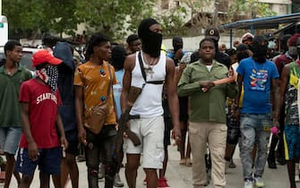 The head of the powerful Haitian armed gang G9 Jimmy Cherisier (2-R), alias Barbecue, led a demonstration attended by several hundred people calling for the removal of Prime Minister Ariel Henry from power in Port-au-Prince, Haiti, 19 September 2023. Escorted by several hooded and armed men, Barbecue demanded the resignation of Henry, whom he described as "incapable" of continuing to lead the country.  ANSA/Johnson Sabin