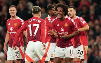 Manchester United's Joshua Zirkzee celebrates scoring their side's first goal of the game during the Premier League match at Old Trafford, Manchester. Picture date: Friday August 16, 2024.