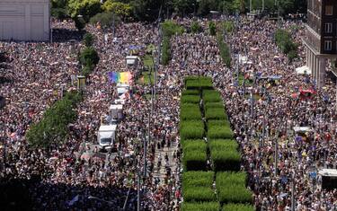 People take part in the Budapest Pride parade in Budapest downtown on June 28, 2025, as the capital's municipality organised this march by the LGBTQ community, celebrating freedom, in a move to circumvent a law that allows police to ban LGBTQ marches. Hungary's Prime Minister had announced that police will not "break up" Saturday's Budapest Pride march despite issuing a ban, but warned attendees and organisers about the legal consequences. His ruling coalition amended laws and the constitution earlier this year to prohibit the annual celebration, advancing his widely condemned, years-long clampdown on LGBTQ rights in the name of "child protection". (Photo by Peter Kohalmi / AFP)