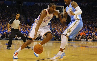 OKLAHOMA CITY, OK - APRIL 17: Kevin Durant #35 of the Oklahoma City Thunder looks to get past J.R. Smith #5 of the Denver Nuggets in Game One of the Western Conference Quarterfinals in the 2011 NBA Playoffs on April 17, 2011 at the Ford Center in Oklahoma City, Oklahoma. NOTE TO USER: User expressly acknowledges and agrees that, by downloading and or using this photograph, User is consenting to the terms and conditions of the Getty Images License Agreement. (Photo by Dilip Vishwanat/Getty Images)