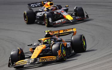 CIRCUIT ZANDVOORT, NETHERLANDS - AUGUST 25: Lando Norris, McLaren MCL38, leads Max Verstappen, Red Bull Racing RB20 during the Dutch GP at Circuit Zandvoort on Sunday August 25, 2024 in North Holland, Netherlands. (Photo by Andy Hone / LAT Images)