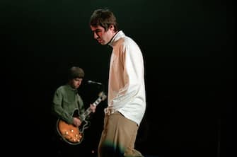 Noel Gallagher, guitarist and his brother Liam, lead singer of British band Oasis perform at Brabanthallen, Den Bosch, Netherlands 27th November 1997. (Photo by Paul Bergen/Redferns)