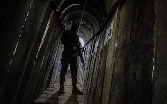 GAZA, PALESTINE - 2022/05/18: A Palestinian fighter of Al-Quds brigades, the military wing of Palestinian Islamic Jihad (PIJ), takes position in a military tunnel near the rally marking the first anniversary of the conflict between Israel and Gaza in Beit Hanun, northern Gaza Strip. (Photo by Mahmoud Issa/SOPA Images/LightRocket via Getty Images)